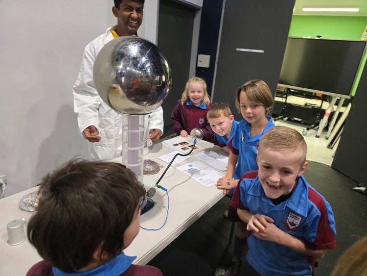 Year 2 exploring a science experiment at our partner high school.