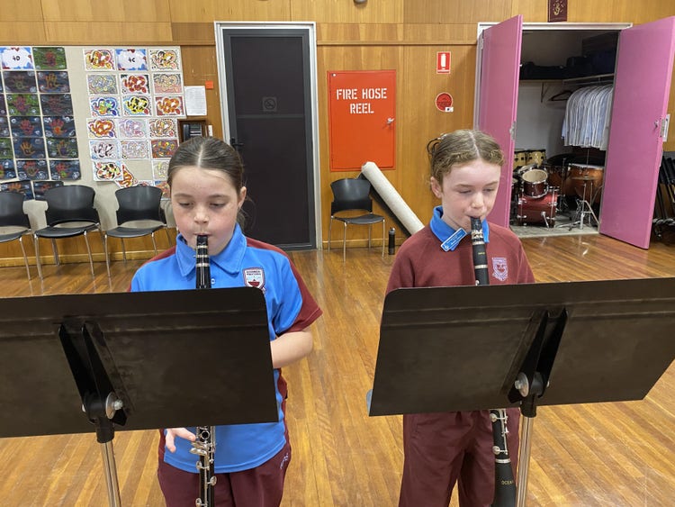 Students playing their instruments.