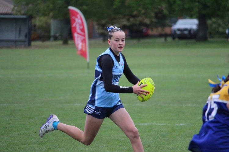 KPS student playing touch in the state team.