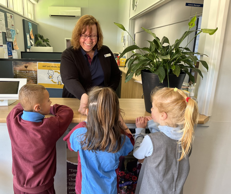 Three students in the front office.