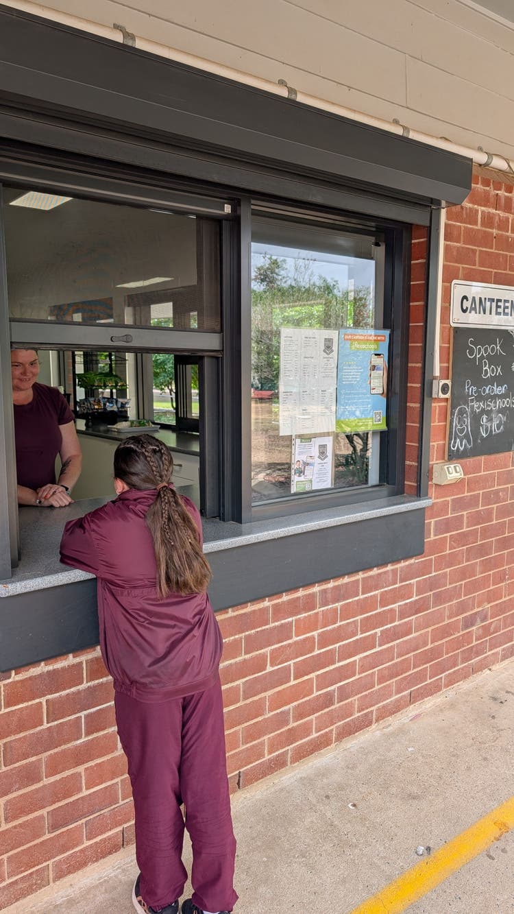 Student ordering at the canteen.