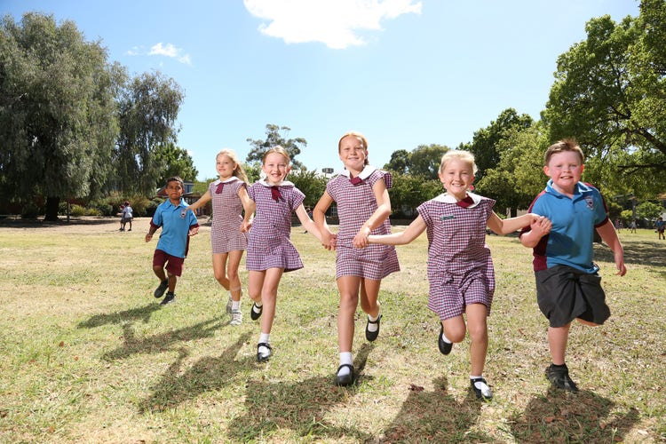 An image of Kooringal Public School students running at the camera.